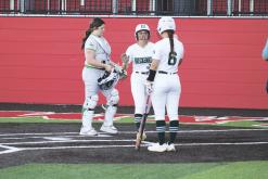 Mia Castillo (10) is met at home plate by Charlie Salazar (6) after Castillo’s run during the second inning Friday, April 26 against Iowa Park. Photo/Mike Williams